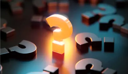 Glowing orange question mark among dark metallic ones